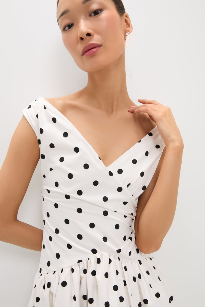 Classic Cream Polka Dot Cotton Midi Dress with V-neck wrap bodice and gathered waist, showcasing an effortless, fun, and high-end style. Perfect for any occasion.