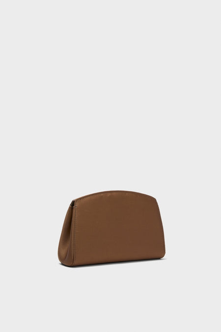 Brown Satin Pushlock Clutch with a classic, curved-top silhouette, effortlessly combining high-end design with fun practicality. Features smooth material and neatly stitched seams.