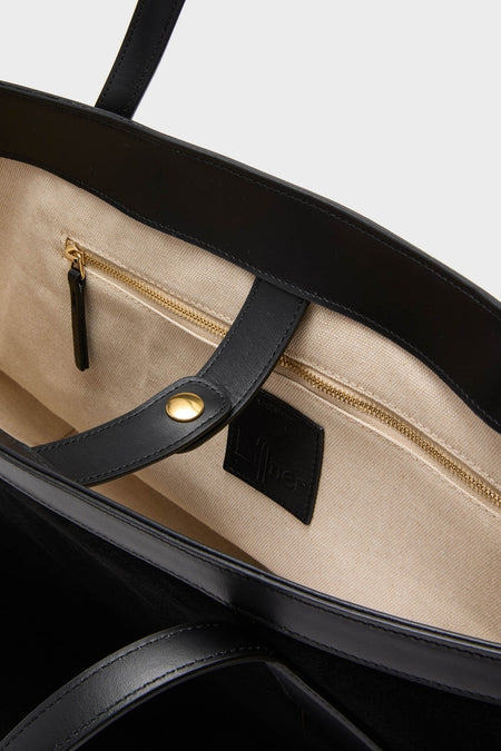 Black Suede Large Sprout Tote with classic black leather trim, beige canvas interior, gold zipper, and branded label, offering an effortless, high-end look for fun, confident style.
