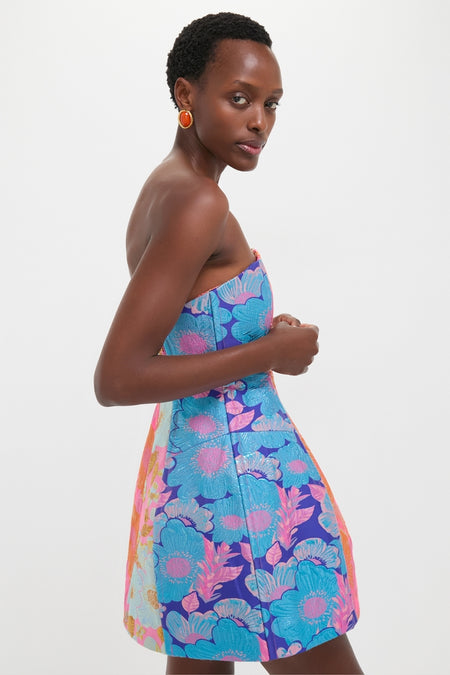 Multi Cosmica Dress: A classic, effortless mini with a structured silhouette in metallic jacquard, showcasing bold floral patchwork, perfect for fun, high-end events.