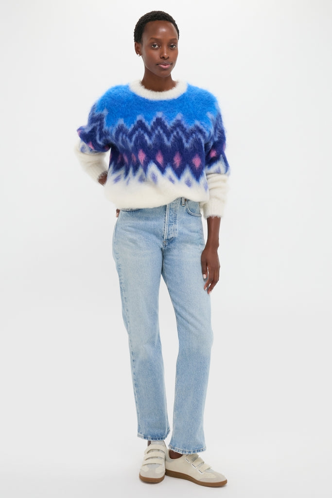 Person wearing the Blue Ambre Sweater with a classic, cozy fair isle pattern, paired effortlessly with light-wash jeans and sneakers, embodying a fun and high-end style.