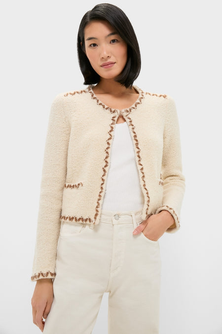 Ecru and Bronze Rochelle Cardigan: A classic, high-end staple featuring contrasting trim and round neckline for an effortless, chic look, paired with cream jeans for timeless style.