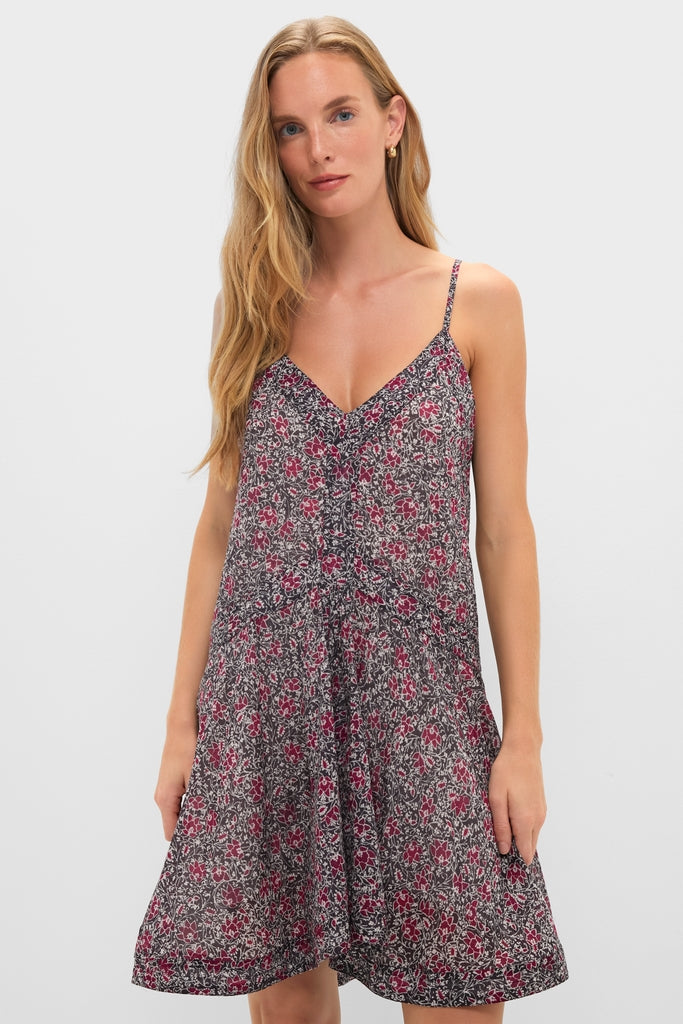 Woman in a Crushed Berry Danielle Dress, showcasing an effortless, high-end style with a classic V-neck and fun floral print, embodying Tuckernuck's chic, ready-for-anything appeal.