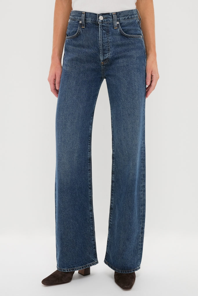 Model wearing Westwood Annina Straight Leg jeans, showcasing a classic, high-rise, wide-leg silhouette paired with dark brown ankle boots for an effortless, high-end look.