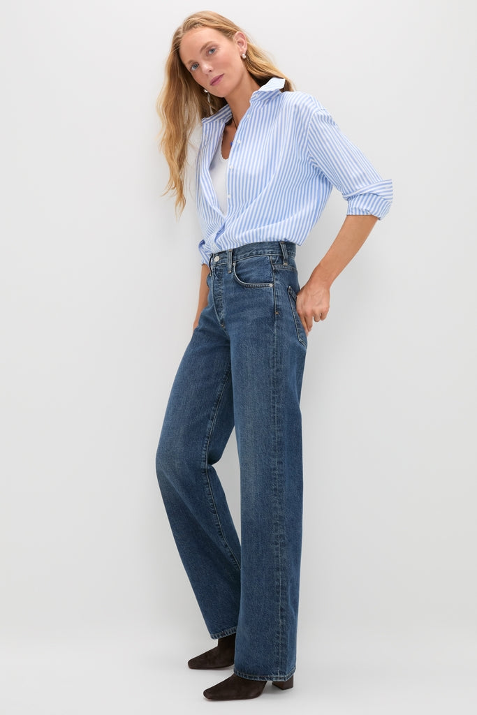 Woman in Westwood Annina Straight Leg jeans, paired with a striped button-down and ankle boots, showcasing a classic, effortless style for a high-end, fun look.