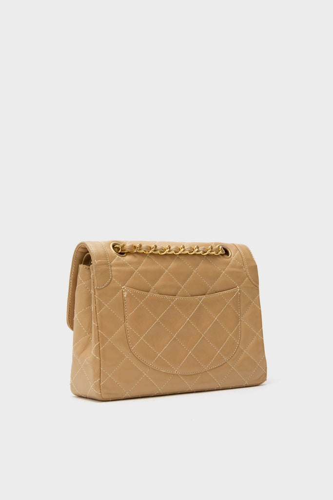 CHANEL CC Mini Paris Double Flap Bag, a high-end quilted leather shoulder bag with diamond-stitch detail and gold-tone chain, embodies classic and effortless style.