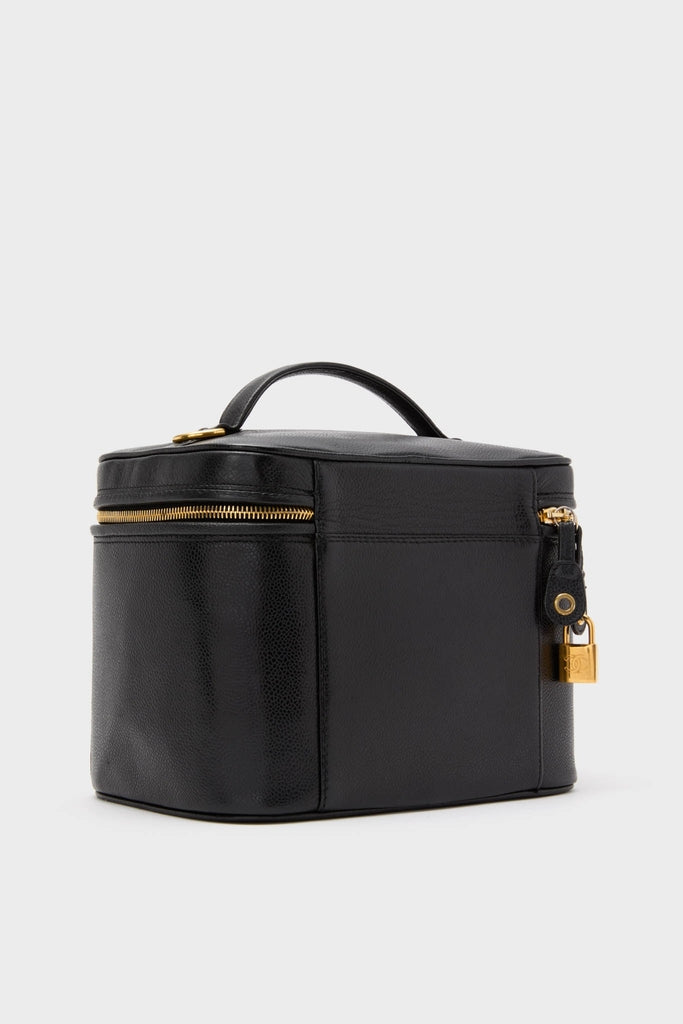 CHANEL Large Caviar Vanity Bag: A classic, high-end travel case in black pebbled leather with gold-tone hardware, exuding effortless style and fun sophistication.