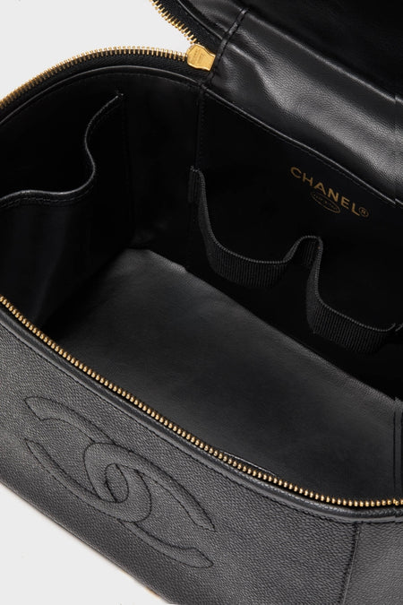 CHANEL Large Caviar Vanity Bag, featuring a classic black leather interior with gold foil logo, elastic loops for tools, and embossed interlocking-C motif for effortless, high-end organization.