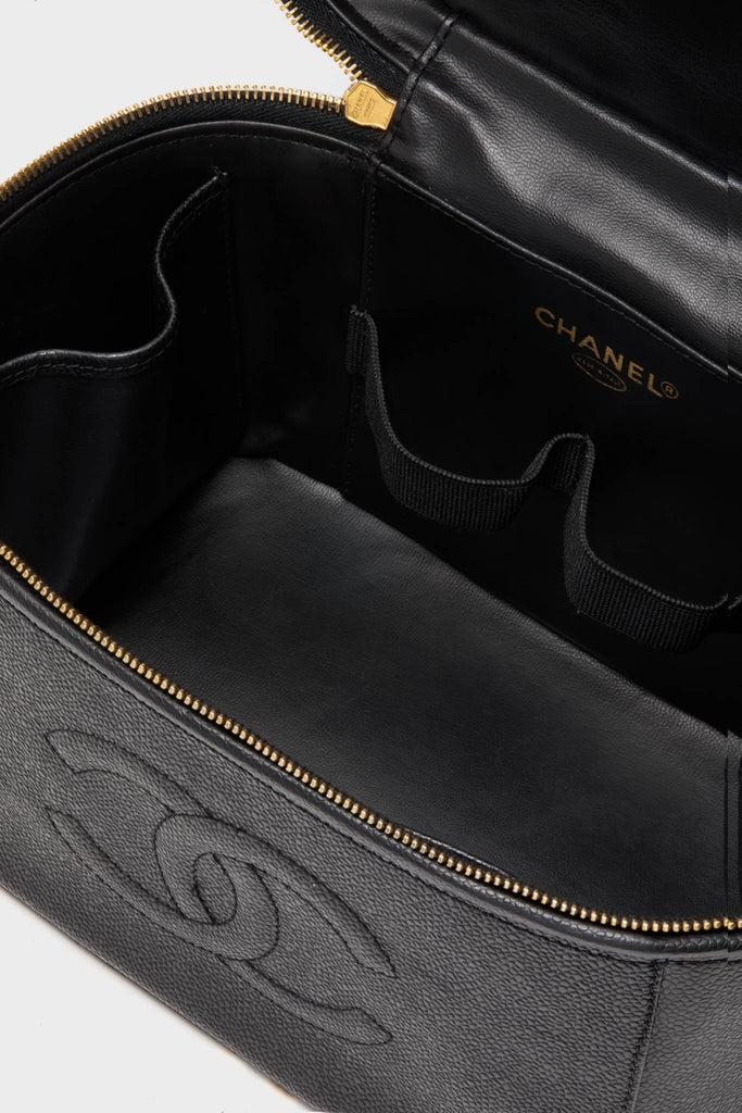 CHANEL Large Caviar Vanity Bag, featuring a classic black leather interior with gold foil logo, elastic loops for tools, and embossed interlocking-C motif for effortless, high-end organization.