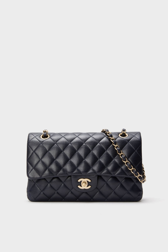 Classic CHANEL Navy Blue Lambskin Double Flap handbag with gold-tone chain-link strap and interlocking “CC” clasp, exuding effortless, high-end style and fun sophistication.