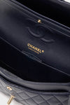Classic CHANEL Navy Blue Lambskin Double Flap bag interior, featuring navy leather lining, stitched CC logo, and gold CHANEL Made in France stamp, exuding effortless, high-end elegance.