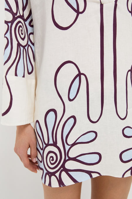 Namur Celeste Siena Dress: A classic, effortless tunic with a deep V-neckline and kimono sleeves. Features a high-end, fun floral print on lightweight linen fabric.