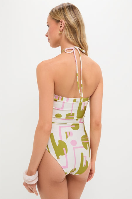 Back view of a woman wearing the Off-White Balearic Applique Swimsuit, featuring an abstract geometric print, exuding a classic and effortless high-end style.