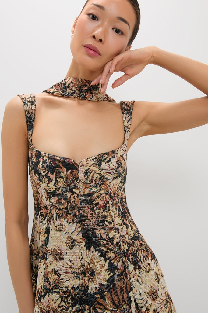 Young woman in a classic, tapestry-style Mirelle Jacquard Zinnia Midi Dress, featuring a chic square neckline and removable scarf, exuding effortless, high-end style.