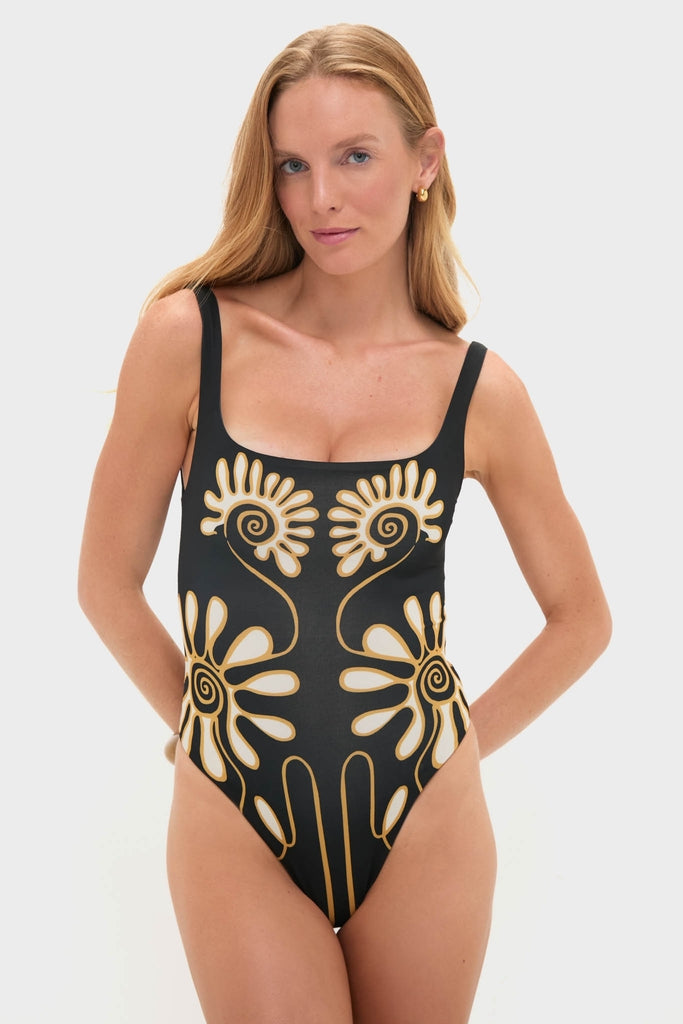 Model wears the Namur Black and White Vienna One Piece, featuring a classic, effortless floral motif, embodying Tuckernuck's fun and high-end style.