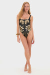 Woman wearing the Namur Black and White Vienna One Piece, a classic and high-end black swimsuit with a bold gold motif, exuding an effortless and fun style.