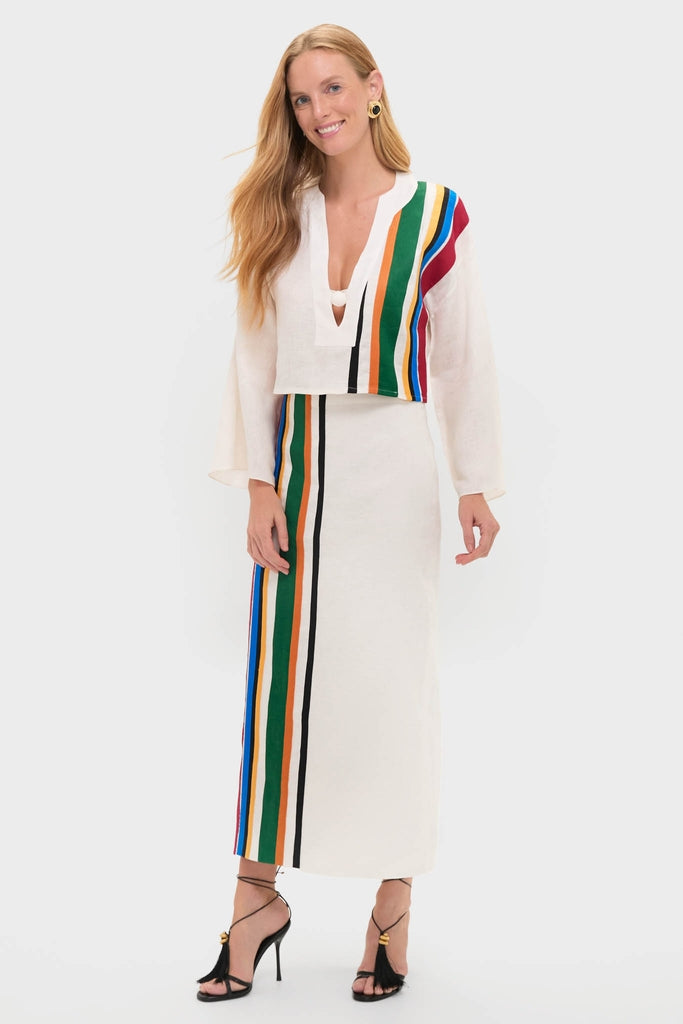 Model wearing the Roman Sassari Top, a classic, effortless two-piece outfit with vertical stripes, accessorized with gold hoops and black high-heeled sandals.