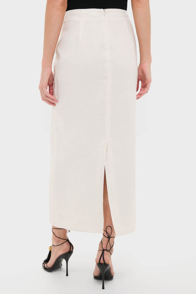 Back view of a model in the Roman Lima Midi Skirt, a high-waisted, ankle-length classic piece with a center-back zipper, paired with black lace-up stiletto sandals.