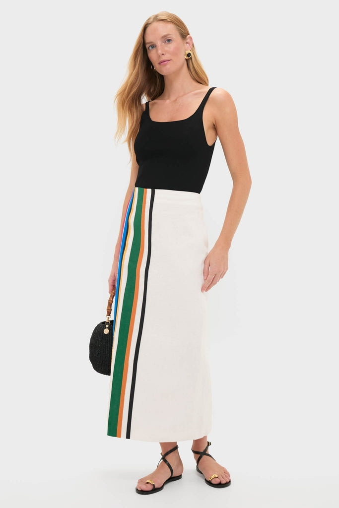 Model wearing the Roman Lima Midi Skirt, a classic high-waisted piece with vibrant stripes, styled effortlessly with a black tank and fun accessories for a high-end look.