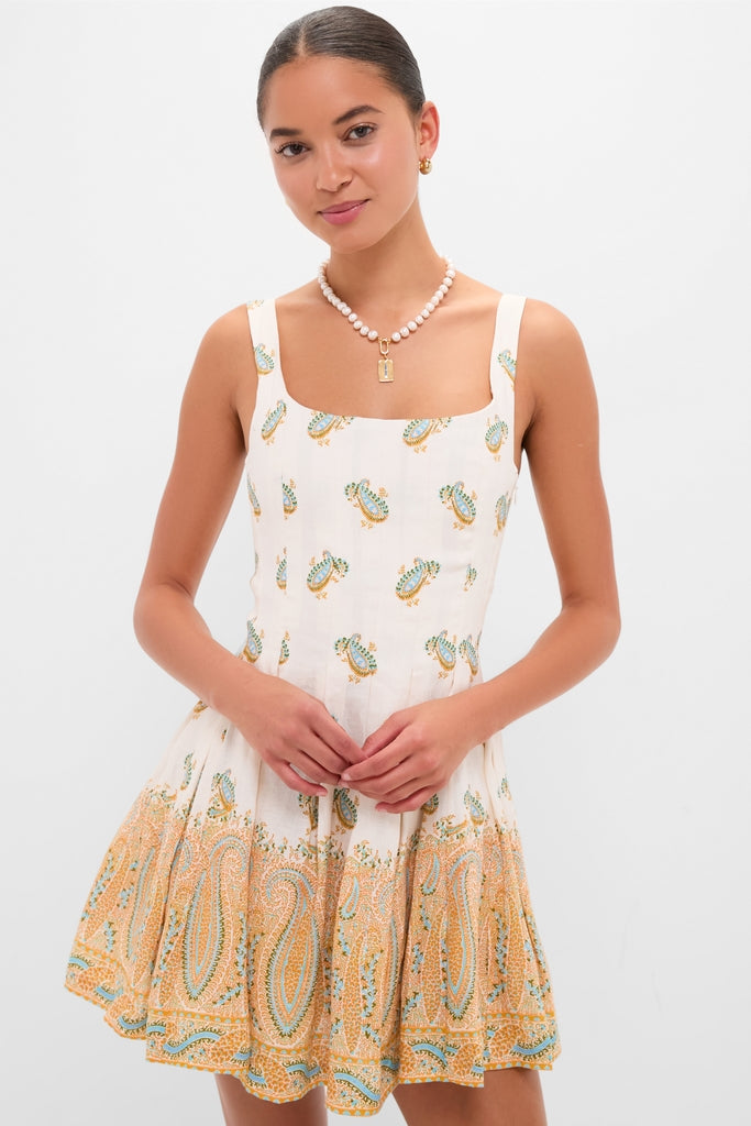 Cree Jardin Bodice Mini Dress: A classic, effortless sundress with a paisley motif, perfect for fun, high-end poolside lunches, featuring structured panels and elegant gold accessories.