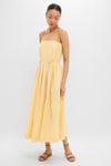 Woman models the Banana Lopez Midi Dress, a classic, effortless A-line sundress with adjustable straps and removable tie, paired with fun, high-end strappy sandals.