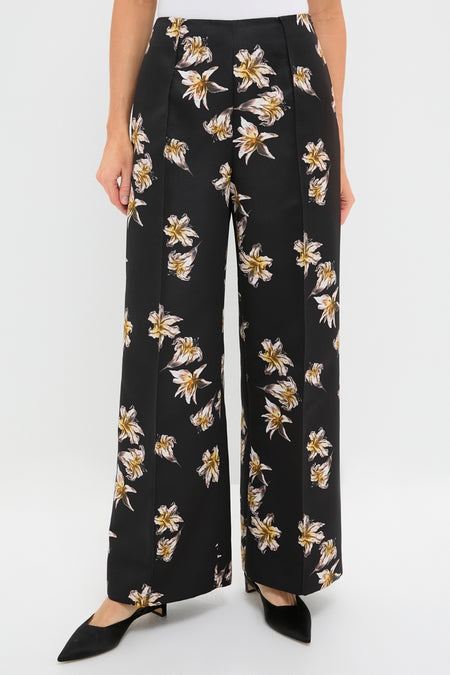 Black and Yellow Daffy Trousers featuring a classic wide-leg design with high waist and front seam detailing, adorned with cream and yellow lilies for an effortless, high-end look.