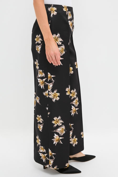 Black and Yellow Daffy Trousers featuring a classic high-waist and wide-leg design, adorned with fun, daffodil-like prints, creating an effortless, high-end look.