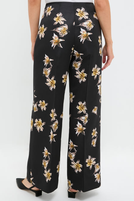 Black and Yellow Daffy Trousers feature a classic high-waisted, wide-leg design with an effortless floral motif, embodying a fun, high-end style suitable for any occasion.