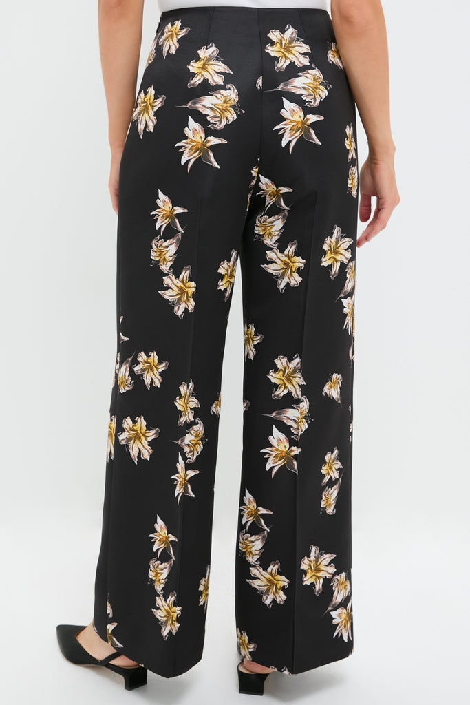 Black and Yellow Daffy Trousers feature a classic high-waisted, wide-leg design with an effortless floral motif, embodying a fun, high-end style suitable for any occasion.