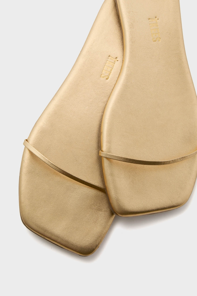 Blink Square Toe Twiggy Sandals feature a sleek, effortless design with a slim gold strap and modern square toe, embodying classic, high-end minimalism for fun, sophisticated wear.
