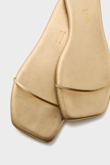 Blink Square Toe Twiggy Sandals feature a sleek, effortless design with a slim gold strap and modern square toe, embodying classic, high-end minimalism for fun, sophisticated wear.