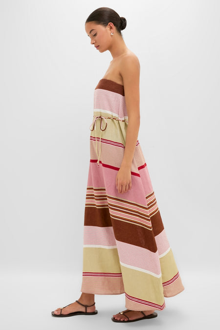 Young woman models the Dust Mauve Barragan Stripe Yolina Maxi Dress, a classic, effortless 100% linen strapless dress with a fun, removable belt, embodying high-end vacation style.