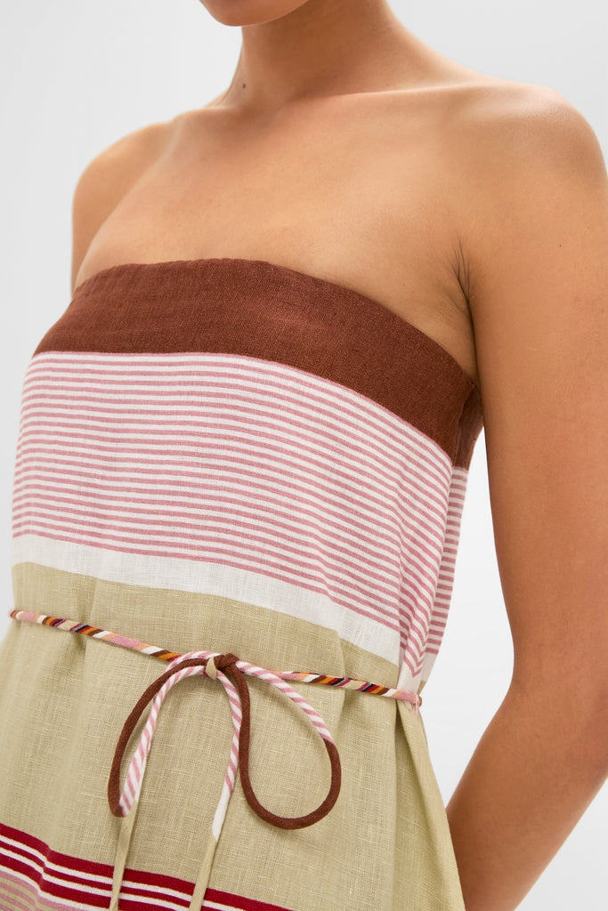 Dust Mauve Barragan Stripe Yolina Maxi Dress showcases an effortless, classic strapless design with a shirred bodice, removable belt, and fun, high-end multi-color stripes.