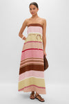 Model in a classic, effortless Dust Mauve Barragan Stripe Yolina Maxi Dress with strappy sandals and tote, embodying high-end, fun vacation style.