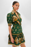 Ayla Green Mini Dress: A classic, effortless wrap-style dress with floral and paisley motifs, featuring a collared neckline and puff sleeves, epitomizing fun and high-end style.