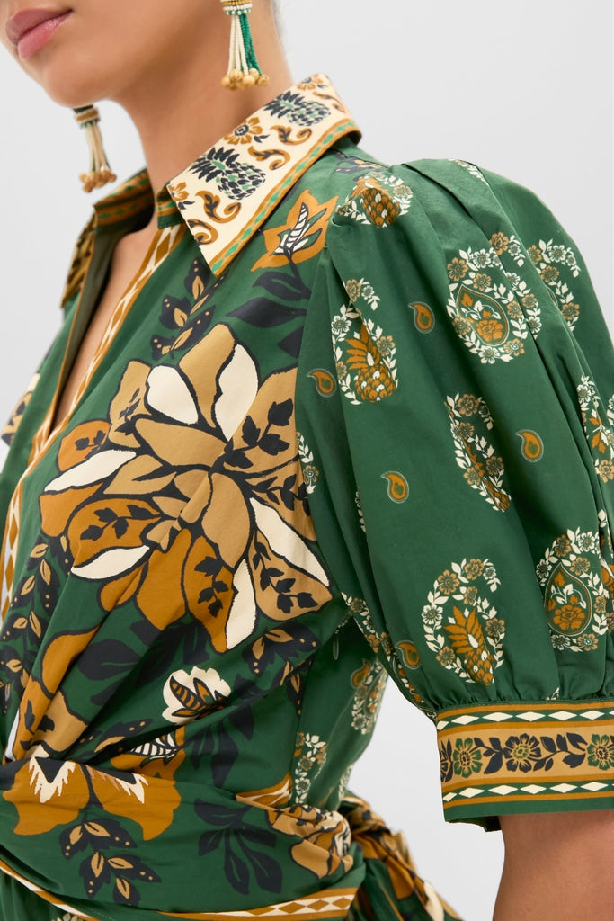 Ayla Green Mini Dress with bold floral and paisley print, featuring puffed sleeves, a matching collar, and waist tie, exudes classic, effortless, and fun high-end style.