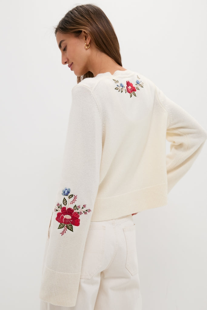 Cream Flowers Embroidered Knit Cardigan showcases classic, effortless style with floral embroidery and a relaxed fit, capturing Tuckernuck's fun and high-end shopping experience.