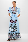 Woman in Blue Artisanal Short Sleeve Maxi Dress with a deep V-neck, floral embroidery, puffed sleeves, and a flared skirt, exuding a classic, effortless, high-end style.