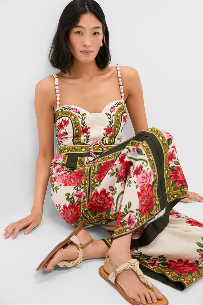 Wonder Rio Sand Sleeveless Maxi Jumpsuit featured on a model, showcasing its classic, effortless design with beaded belt detail and braided sandals for a fun, high-end summer look.