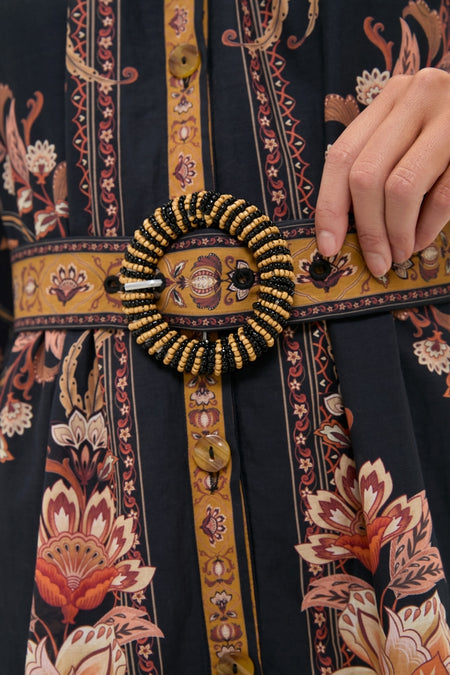 Majestic Garden Black Mini Dress close-up: classic, high-end design with a fun floral-geometric print, featuring an effortless belt with a beaded buckle.