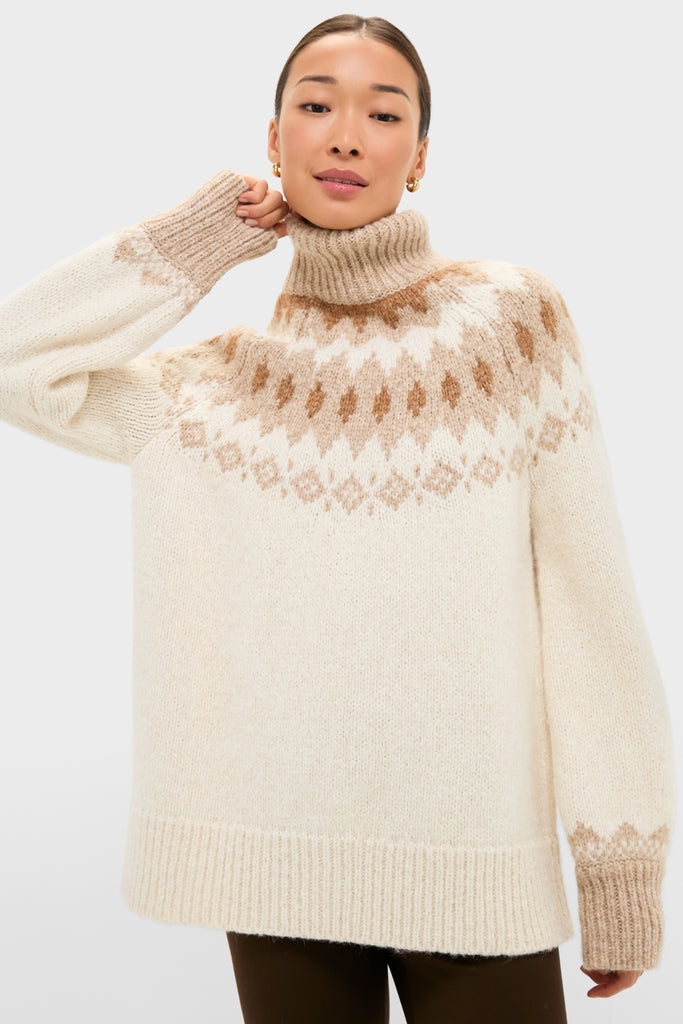 Ivory Camel Estelle Fair Isle Turtleneck: A classic, effortlessly cool sweater with a high neck and geometric pattern, perfect for high-end, fun, and stylish cold-weather outings.
