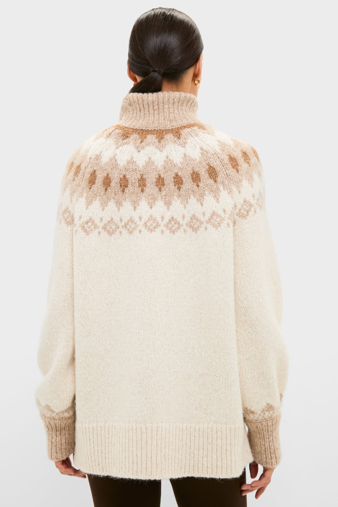 Model in an Ivory Camel Estelle Fair Isle Turtleneck, showcasing its classic, effortless design with a chunky knit and ribbed finishes for a high-end, fun look.