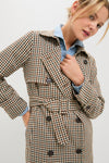 Classic and high-end, the Brown Plaid Long Trench Coat features a double-breasted design and belt, effortlessly paired with a light blue chambray shirt for a fun, confident look.