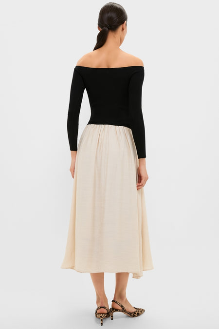 Classic Black and Ivory Off Shoulder Maxi Dress featuring an effortless silhouette with a fitted bodice and A-line skirt, embodying high-end, fun elegance.