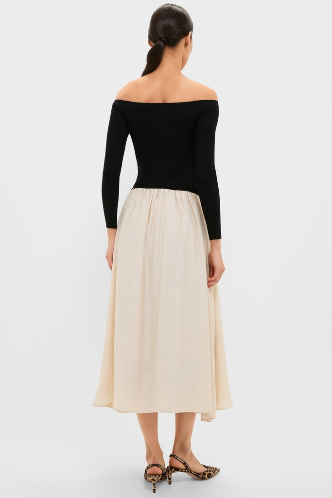 Classic Black and Ivory Off Shoulder Maxi Dress featuring an effortless silhouette with a fitted bodice and A-line skirt, embodying high-end, fun elegance.