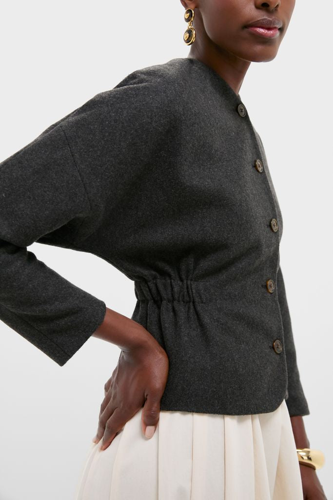Charcoal Light Atelier Cinch Jacket: A classic, high-end, effortless piece with a cinched waist, drop-shoulder sleeves, and gold accessories, ideal for fun, confident styling.
