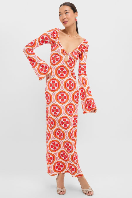 Model wearing the Pink Retro Radiance Diana Bell Maxi Dress, featuring a classic geometric print, effortless bell sleeves, and a fun keyhole detail, embodying a high-end, laid-back style.