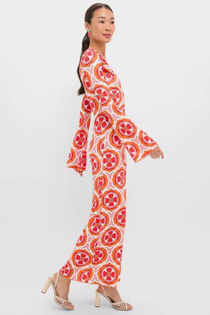 Woman in profile wearing the Pink Retro Radiance Diana Bell Maxi Dress, a classic, effortless jumpsuit with bell sleeves and a deep V-neckline, exuding high-end, fun bohemian style.