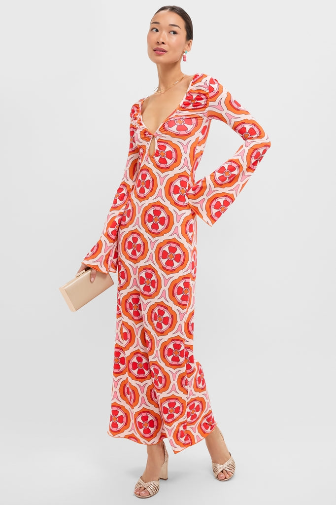 Model wearing the Pink Retro Radiance Diana Bell Maxi Dress with classic bell sleeves and V-neck, styled effortlessly with a clutch and heels for a high-end, fun look.