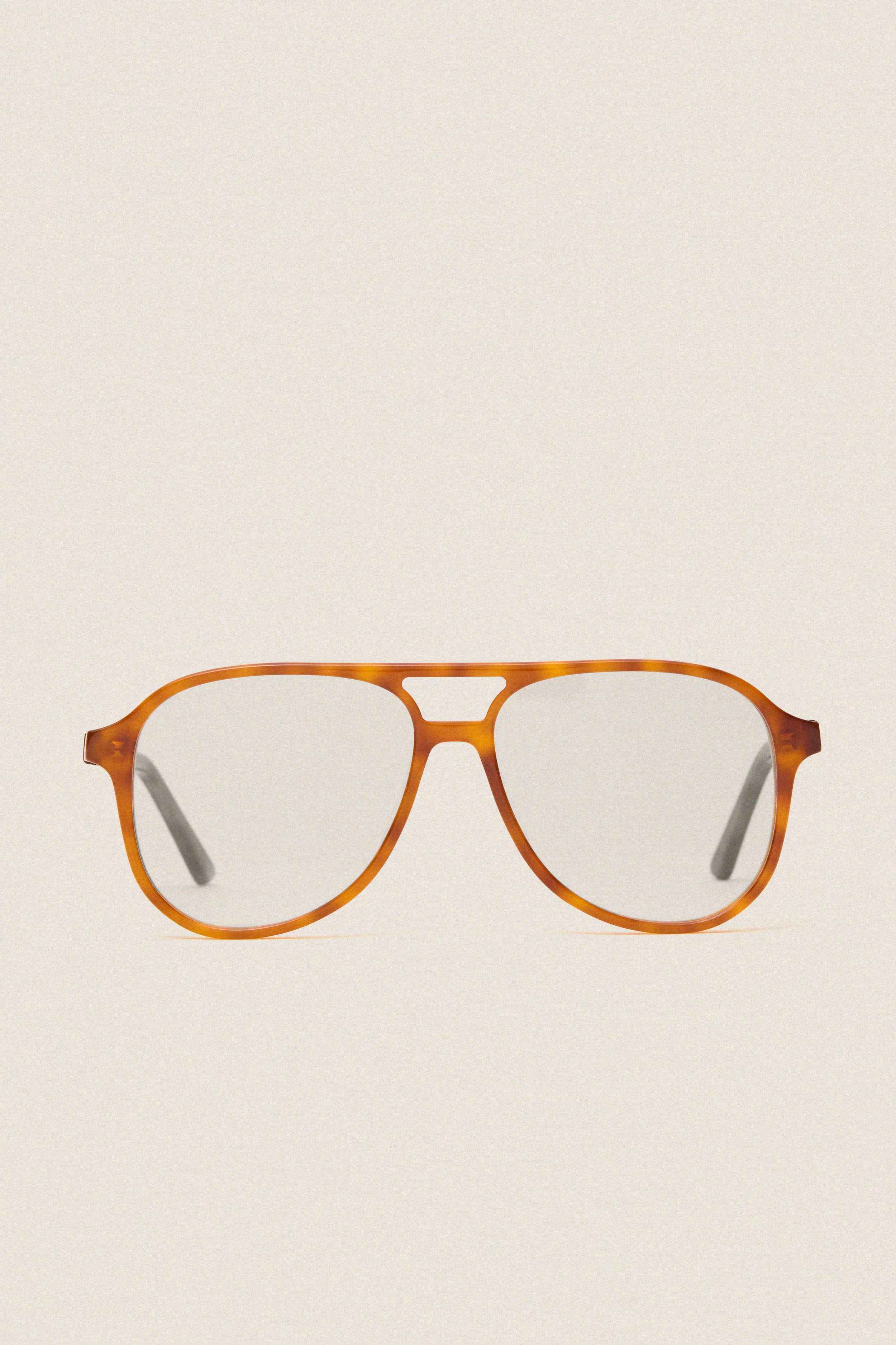 Maple Blue Light Scout Glasses feature classic tortoiseshell aviator frames with clear lenses, offering effortless style and high-end protection for fun, adventurous days.